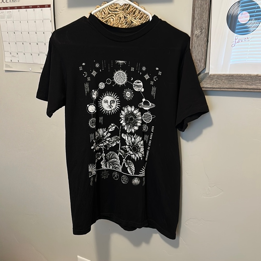 Oversized black tee with graphic design.